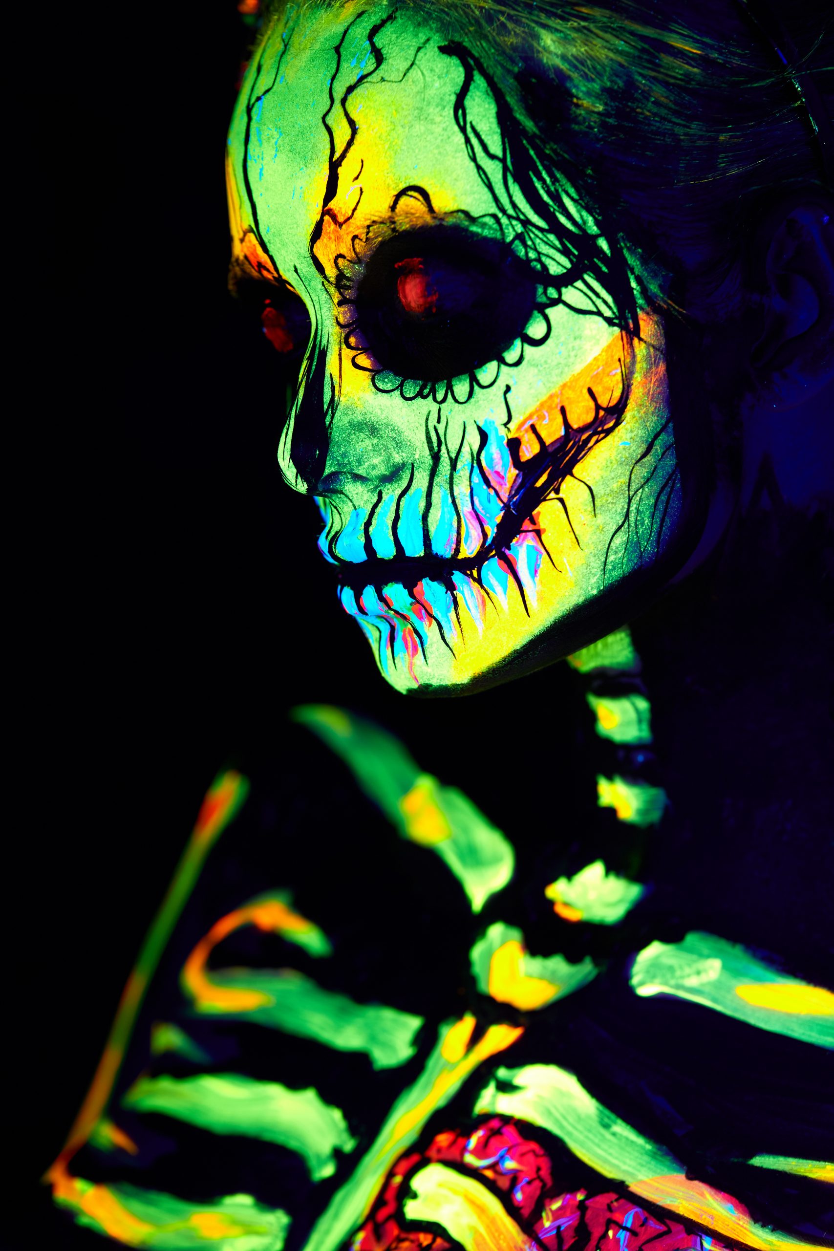 Close up UV body painting of skeleton